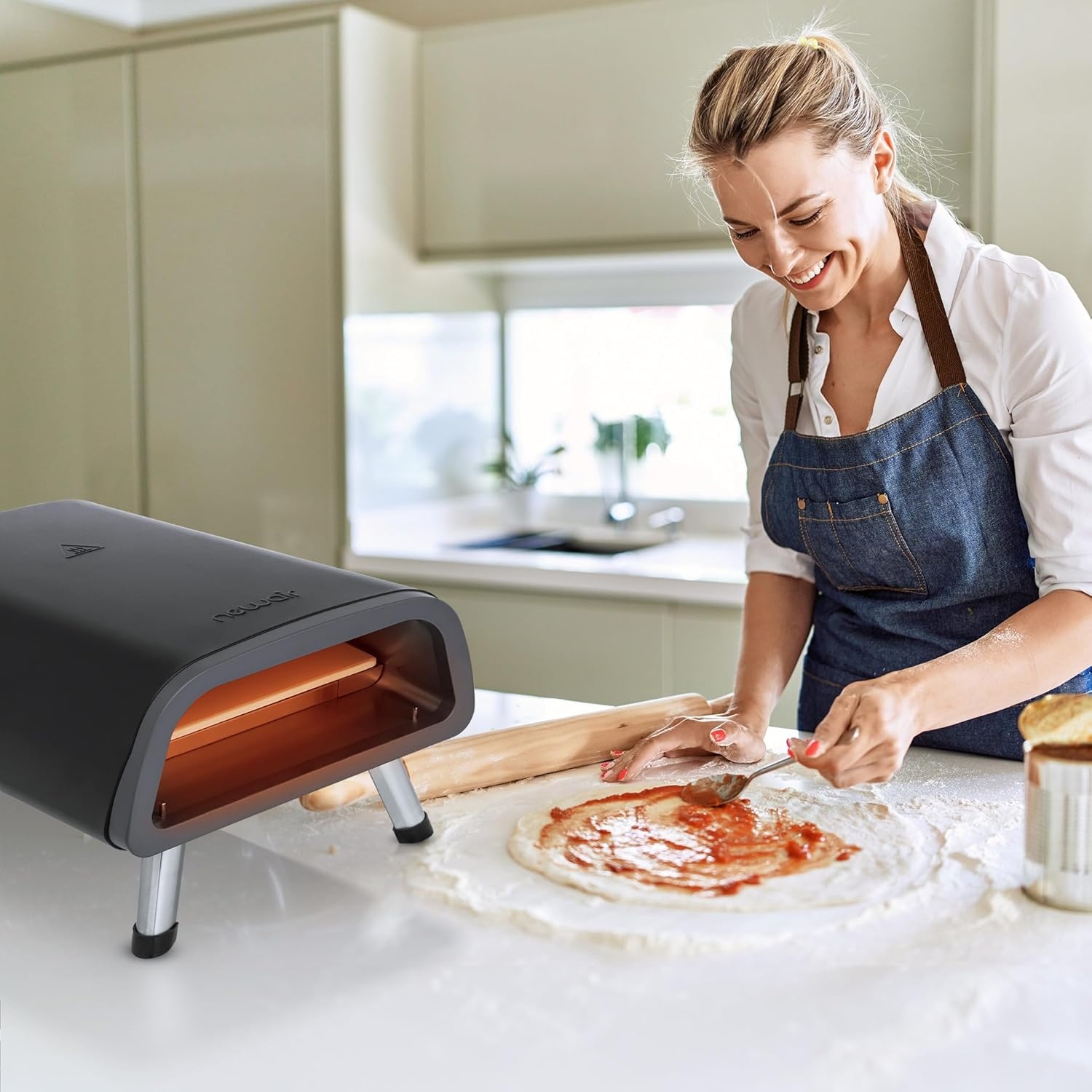image:imageNewair 12 Portable Electric Pizza Oven 900F Countertop Pizza Maker for Indoor amp Outdoor Use Dual Heating Elements Foldable Legs amp Pizza Stone