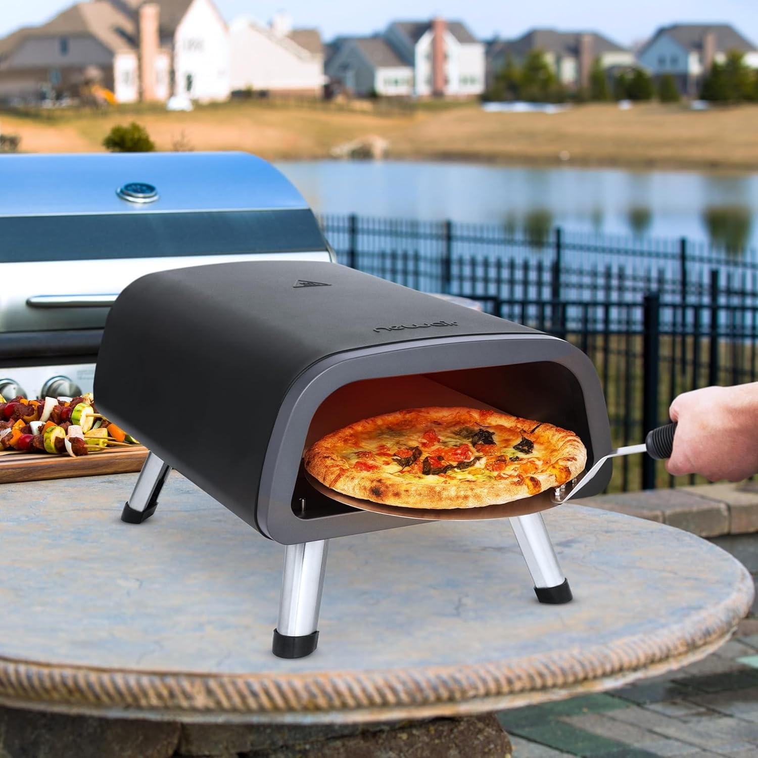 image:imageNewair 12 Portable Electric Pizza Oven 900F Countertop Pizza Maker for Indoor amp Outdoor Use Dual Heating Elements Foldable Legs amp Pizza Stone